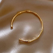Bamboo Bangle Bracelet for Women — 18K Gold Plated, Cuff Bangle, Stackable on model